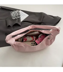 Top-down view of pink dumpling bag interior showing spacious capacity for daily items