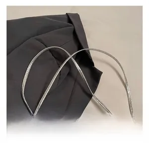 Detailed close-up of slim silver faux snake skin strap with high metallic luster finish