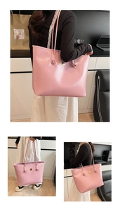 Detail of pink glossy leather tote bag showing shoulder strap knot and metal ornament