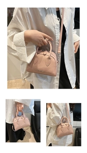 Detailed views of a pink lychee pattern Boston bag with top handles and a thin shoulder strap