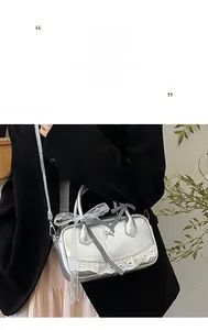 Silver bowling bag featuring white heart lace trim and a plaid bow decoration