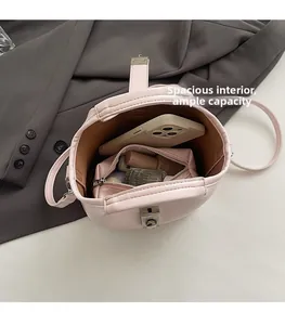 Interior view showing the large capacity and storage space of pink bucket bag