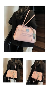 Detailed view of pink PU shoulder bag featuring woven tassel and metal logo plate