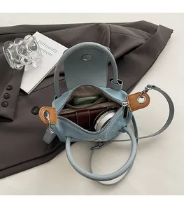 Internal view of the denim crossbody bag showing spacious room for daily essentials