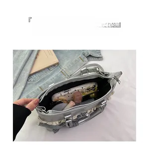 Internal view of silver tote bag showing spacious capacity for makeup and accessories
