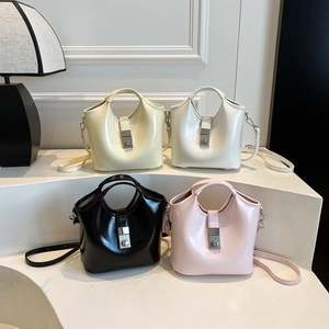 Bolsos tipo cubo de cuero brillante de dos piezas en cuatro colores con hebillas de metal