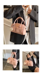 Pink patent leather Boston bag detail with pearl heart charm and dual handles