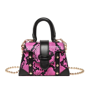 Pink snakeskin pattern handbag with gold studs and a delicate chain shoulder strap