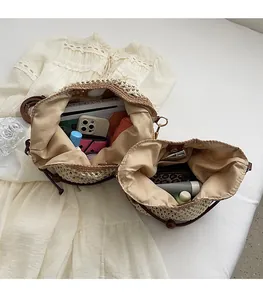 Top view of two beige straw woven tote bags showing inner linings and storage capacity