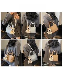 Litchi texture leather bucket bag shown in multiple carrying styles with a cute bear charm