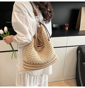 Detail of hand-woven crochet shoulder bag with dark brown wood beads and drawstring closure