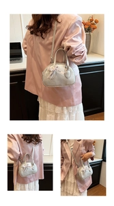 Silver sequin bowling bag detail with Just For You ribbon and metallic shoulder strap