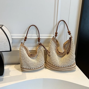 Chic woven crochet shoulder bag set with brown leather handles and wooden bead accents