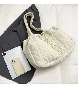 Quilted white tote bag size comparison with iPad and phone showing spacious interior
