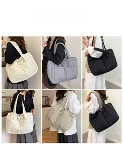 Multiple views of quilted tote bags in white grey black and khaki with drawstring details
