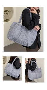 Detail of light grey quilted tote bag featuring leaf vein pattern and padded shoulder strap