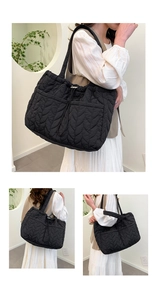 Detail of black quilted tote bag showing leaf vein texture and drawstring closure