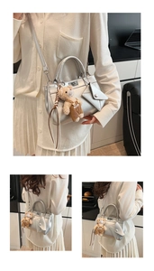 Silver metallic square crossbody bag with cute teddy bear charm and mini pouch accessory