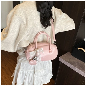 Sweet pink bowling handbag with lace ribbon charm, stylish PU leather crossbody bag for women.