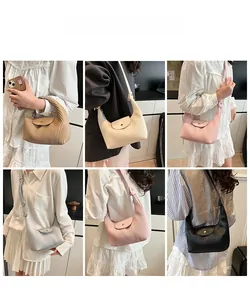 Detail showing various colors of pleated crescent shoulder bags for spring 2025 fashion