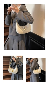 Three-way view of white hobo bag with gold buckle on vintage staircase setting