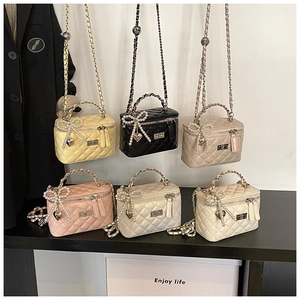 Detailed grid showing six quilted vanity bags with pearl bows and metal chain straps