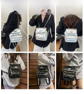 Quilted mini bucket backpack with chain strap and twist lock detail in black and silver