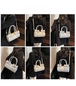 Collage of cream bow cylinder bag shown from multiple angles on a female model