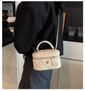 Quilted mini vanity bag in cream white with gold camellia and leather chain strap