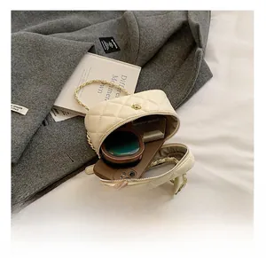 Interior view of quilted cream vanity bag showing space for cosmetics and phone