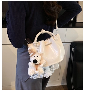Women vintage bucket shoulder bag stylish retro handbag with cute plush bear pendant daily wear.