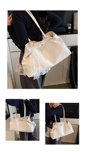 Detail of white shiny tote bag with elegant lace bow and pearl charm decoration