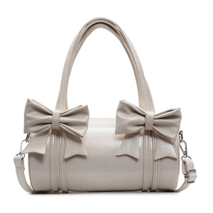 Cream bow barrel handbag with top handles and adjustable strap in minimalist Korean style