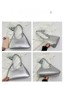 Detailed views of vintage silver shoulder bag showing crackle texture and dimensions