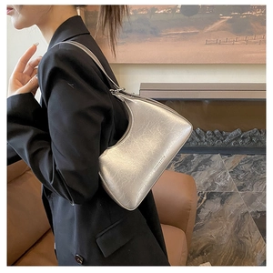 Silver metallic underarm bag with cracked texture and Fashion & Bag printed logo