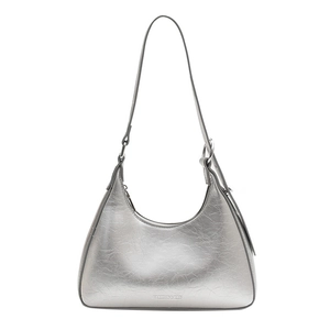 Silver metallic crescent hobo bag with crushed texture and adjustable shoulder strap