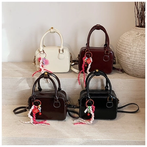 Detailed display of four PU leather Boston bags in cream, burgundy, coffee, and black tones