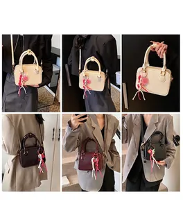 Multi-angle view of minimalist box-shaped Boston bag in beige, red, and black