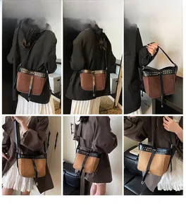 Detail view of contrast stitching messenger bag with metal rivets and suede texture