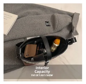 Top view of large capacity leather messenger bag interior showing daily essentials storage