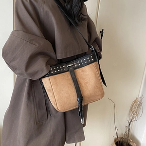 Vintage bohemian messenger bag in brown suede with black leather straps and silver studs