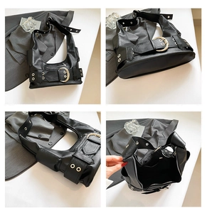 Détails du grand sac cabas noir avec œillets métalliques argentés et boucle décorative
