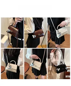Detailed views of high-capacity tote bag in four colors with decorative charm