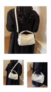 Detailed views of a white glossy shoulder bag showing the embossed logo and strap style