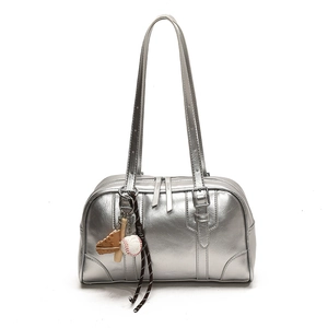 Metallic silver leather tote bag with baseball charms and shiny mirror finish