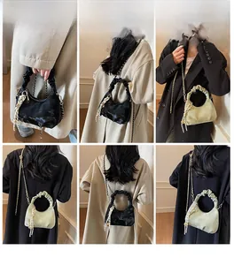 Detail shots of pleated dumpling bag with chain strap and scarf decor in multiple views