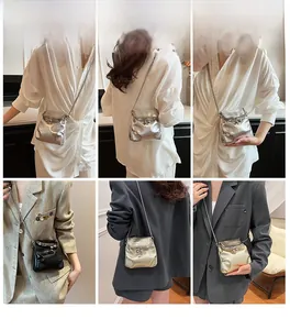 Mini bucket bag detail showing silver, black and gold finishes with chain strap