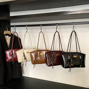 Minimalist glossy shoulder bags for women in five colors with woven tassel detail