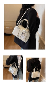 Detail view of cream Boston bag featuring a front transparent card slot and premium PU texture