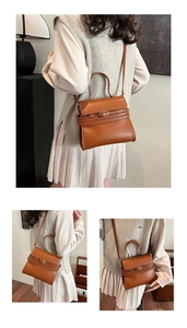 Détails du sac bandoulière en cuir caramel avec sangle décorative et poignée